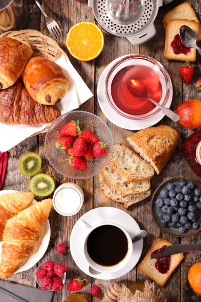 istock continental breakfast with coffee, tea, croissant and fresh fruit 1227082020