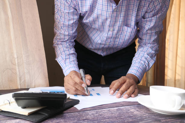 istock The concept of working from home. businessman analyzing financial data on desk 1227085575