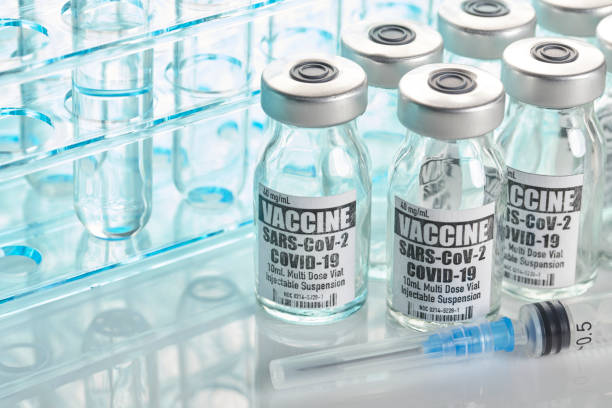 istock Vaccine: Covid-19 with test tubes and syringe 1227086575