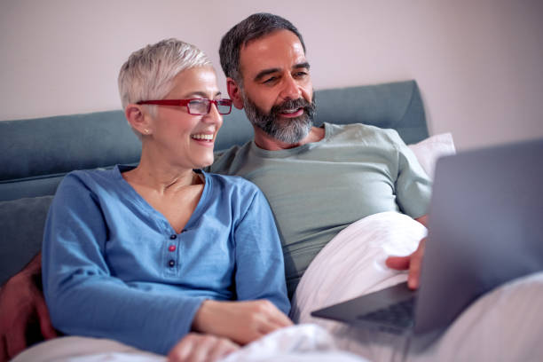 istock Husband and wife relaxing in bedroom 1227087679