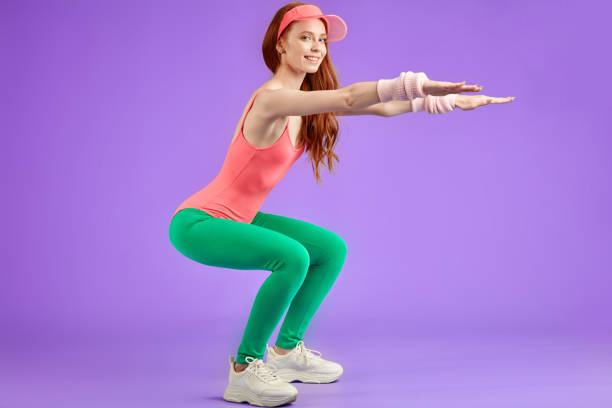 istock young red-haired aerobics girl making aerobics exercises 1227088018