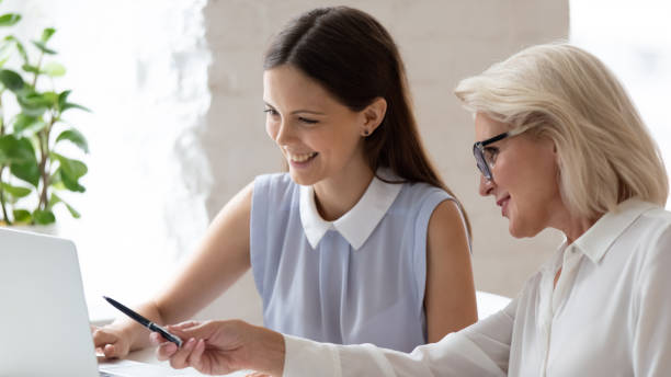 istock Happy diverse female colleagues collaborate at office meeting 1227089143