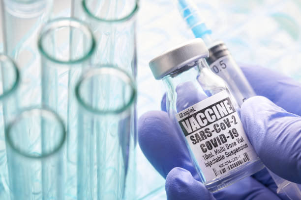 istock Vaccine: Covid-19 with test tubes and syringe 1227089529