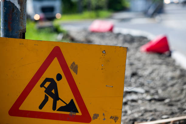 istock Works ahead warning sign on a road. 1227090502