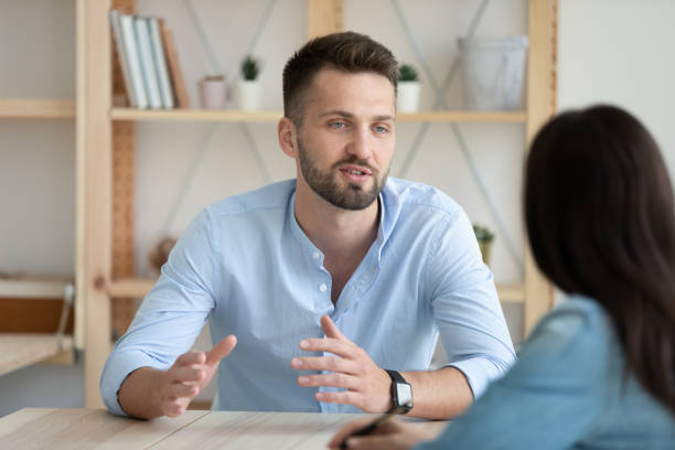 istock Confident male job applicant talk at interview in office 1227091038