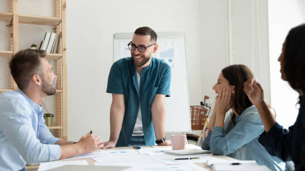 istock Happy diverse colleagues have fun brainstorming at meeting 1227091065