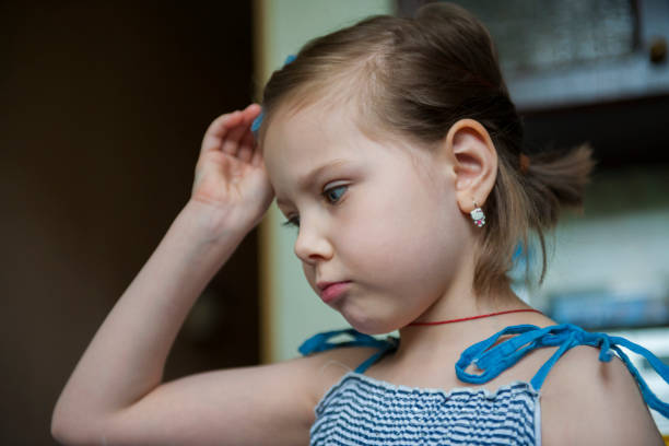 istock Five year old girl in striped clothes 1227092012