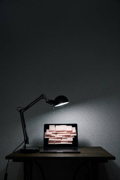 istock Image of laptop full of sticky notes reminders on screen. Late night work overload concept image. Working at home concept image. 1227092558