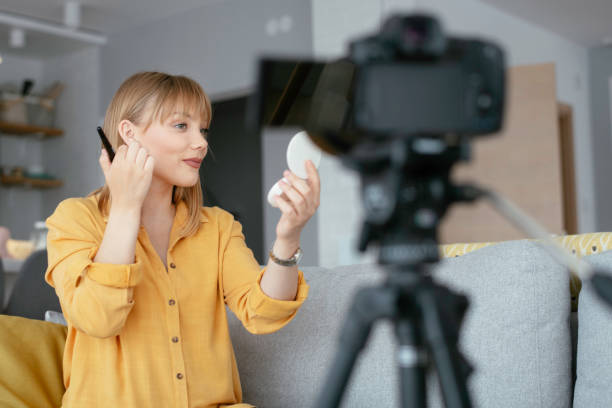 istock Young beautiful woman recording make up tutorial to share on social media. 1227093096