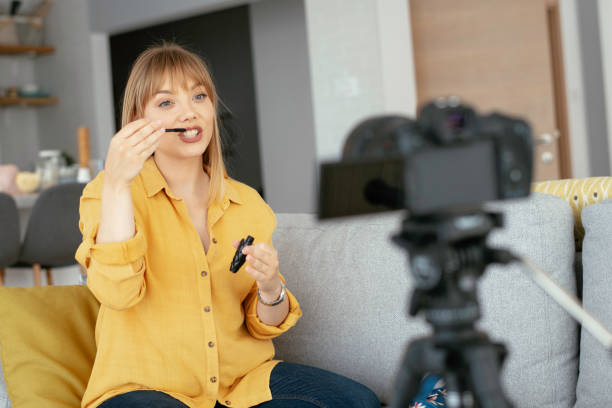 istock Young beautiful woman recording make up tutorial to share on social media. 1227093149