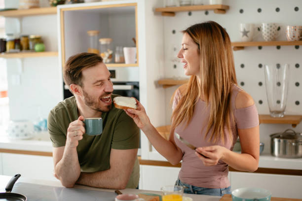 istock Young couple making breakfast at home. 1227093255