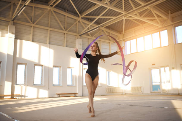 istock Talented gymnast dancing on floor 1227093279