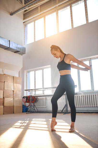 istock Young girl engaged rhythmic gymnastic in gym 1227093595