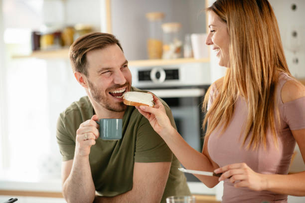 istock Young couple making breakfast at home. 1227094182