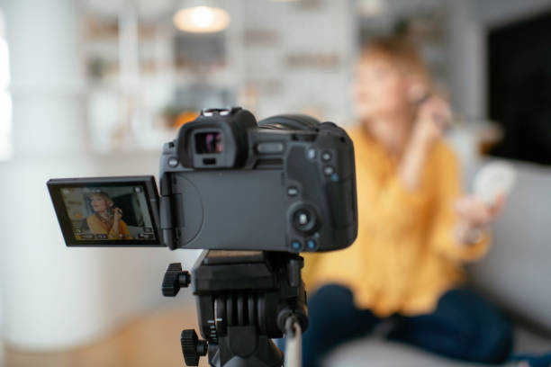 istock Young beautiful woman recording make up tutorial to share on social media. 1227094260