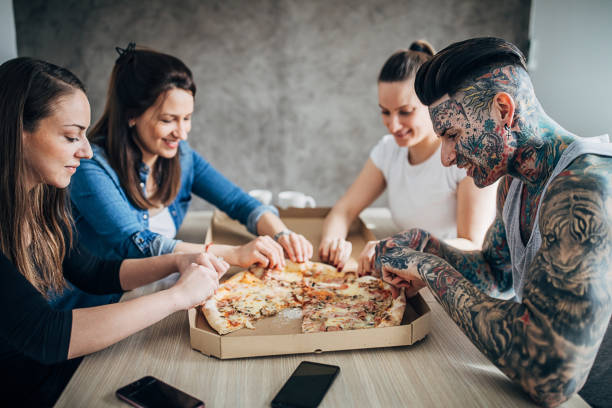 Group of friends eating pizza