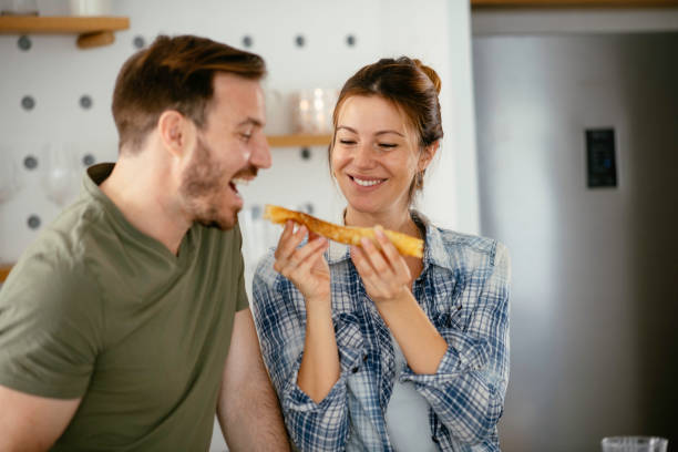 istock Young couple making breakfast at home. 1227094917