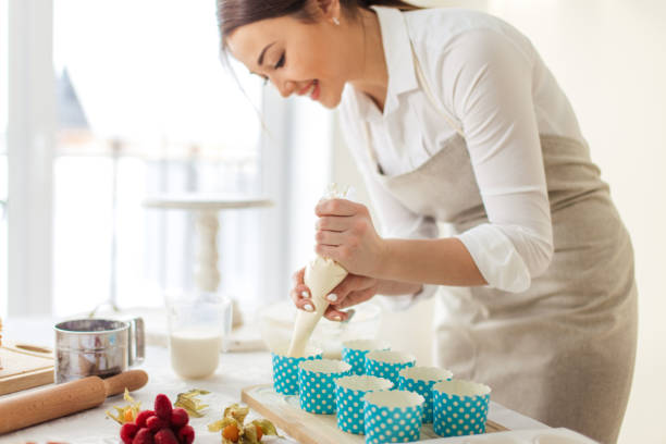 istock positive female chef enjoys cooking 1227095021