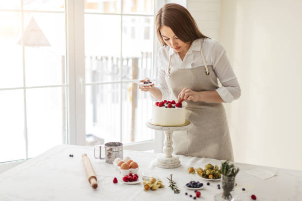 istock pretty girl having fun in the kitchen room 1227095078