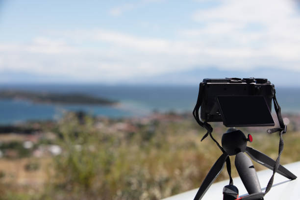 istock Digital camera on camera tripod taking a photo of panoramic  landscape 1227095372