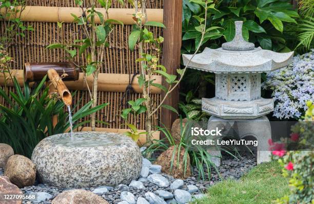 Stone Lantern And Bamboo Fountain Oriental Background Stock Photo - Download Image Now