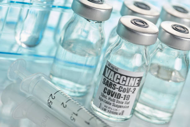 istock Vaccine: Covid-19 with test tubes and syringe 1227096447