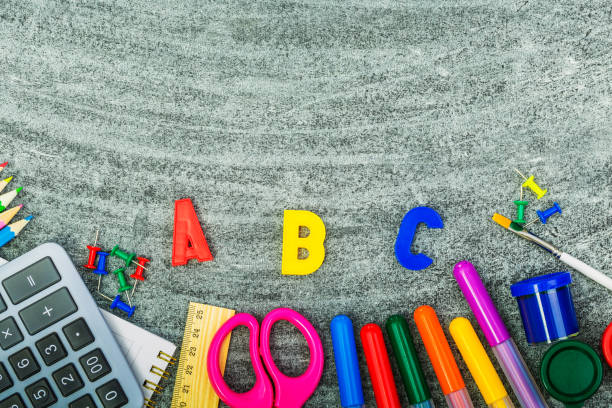 istock School supplies on a blackboard 1227096883