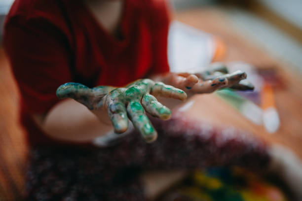 istock Close-Up Of Child Painted Hands 1227099229