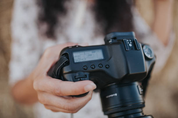 istock Close-Up Of Hand Holding Camera 1227099251