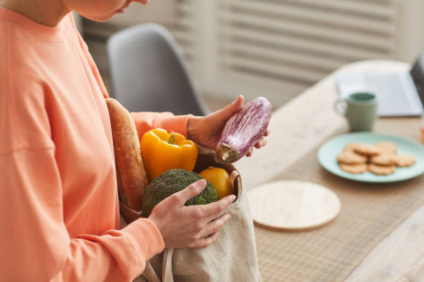 istock Woman buying fresh vegetables 1227099651