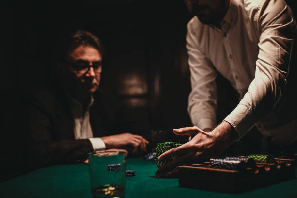 istock Two gentlemens playing poker game 1227102586
