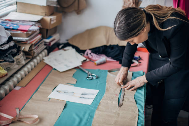 istock Female fashion designer working in her workshop 1227103867
