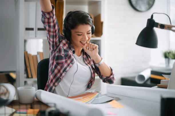 istock Beautiful female architect having fun in the office 1227104030