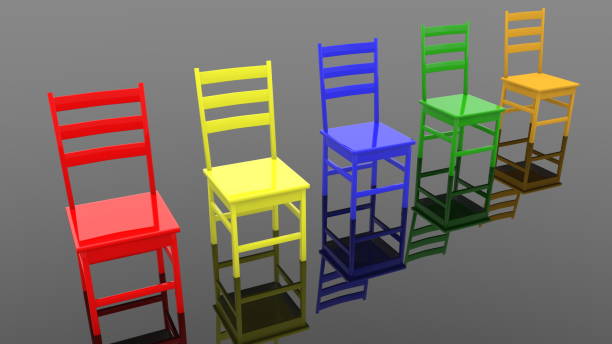 istock Row of colorful chairs on black 1227105219