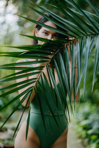 istock young beautiful model around green fresh plants 1227106350