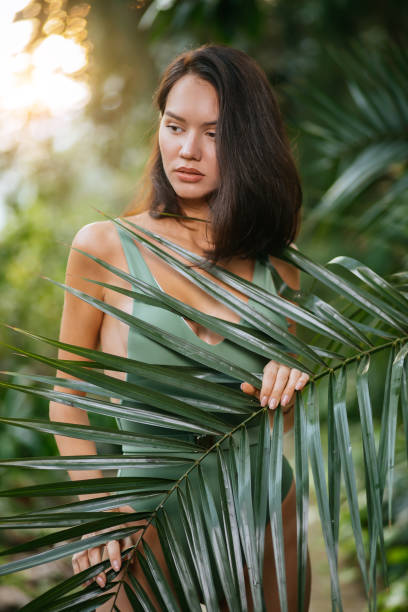istock young sexy lady in tropical rainforest around exotic plants 1227106363