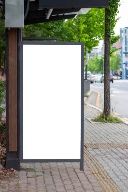 istock White empty advertising mock-up at bus stop, close-up, the front view 1227109645