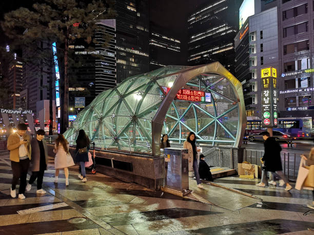 People walking by night at Gangnam station, Seoul, South Korea People walking by night at Gagnam metro station in Seoul, South Korea. kangnamgu stock pictures, royalty-free photos & images