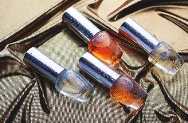 istock Small bottles with perfume on golden fabric 1227119758