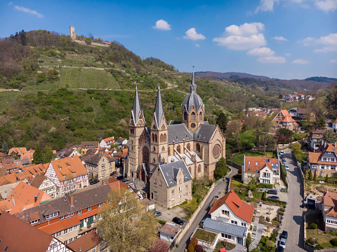 Weinheim. Germany. - April 15, 2019: Beautiful spring photo from above on a church and castle on a mountain in Weinheim.