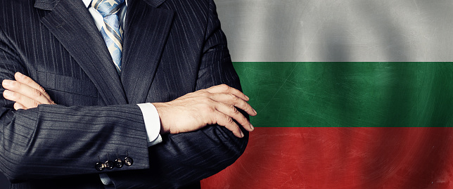 Male hands against Bulgarian flag background, business, politics and education in Bulgaria concept