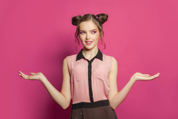 istock Happy model woman on bright pink background 1227125586