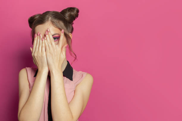 istock Young woman on bright pink background 1227125617