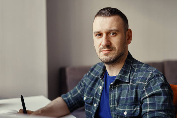 istock Portrait modern man working remotely from home 1227126039