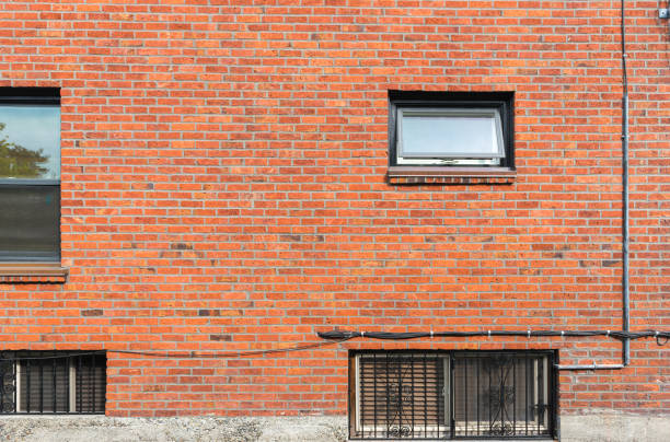 istock old vintage red brick wall texture  with window background,Ready for product display montage. 1227126211