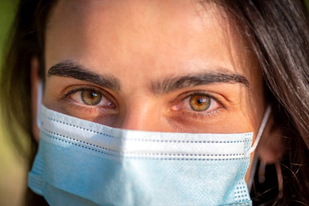 istock Woman with protective mask looking at camera 1227131420