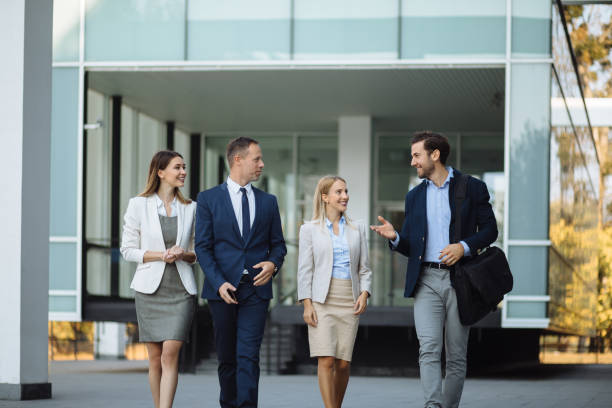 istock Four young executives talking outdoors 1227134027
