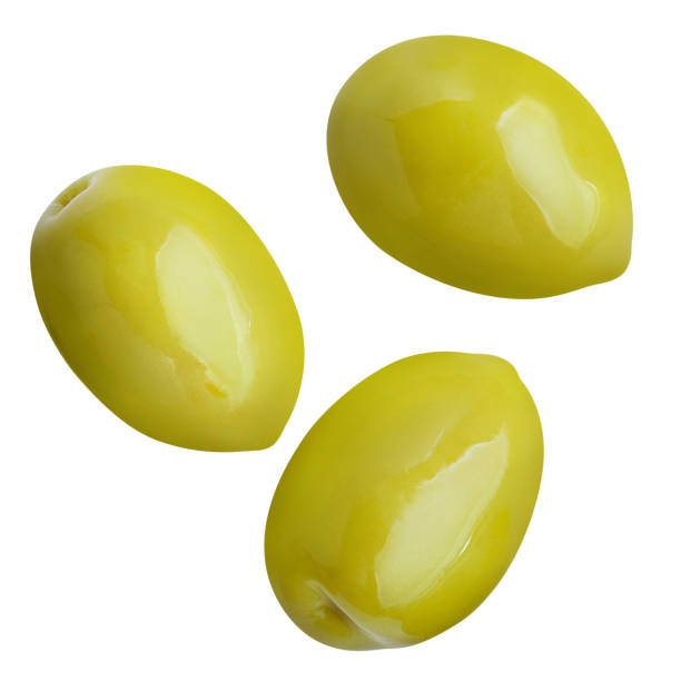 Flying green olives on white Flying green olives, isolated on white background olive tree cut out stock pictures, royalty-free photos & images