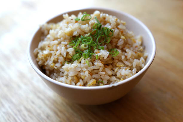 Garlic fried rice close up Close up a bowl of Japanese garlic fried rice fried rice stock pictures, royalty-free photos & images