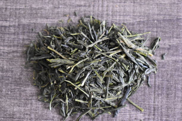 istock Green sencha tea leaves - can be used as a background 1227136831